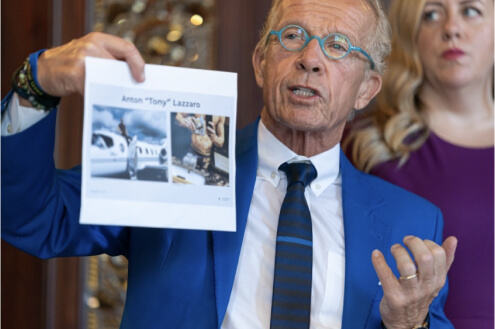 Jeff Anderson holding up a photo of Mr Lazzaro